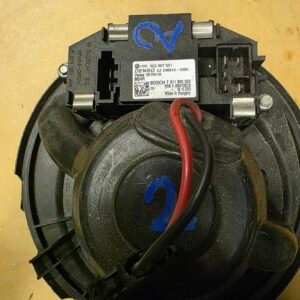 Automotive electrical module with red and black wires and a Bosch/Denso label, likely a clock spring assembly for a car steering wheel.