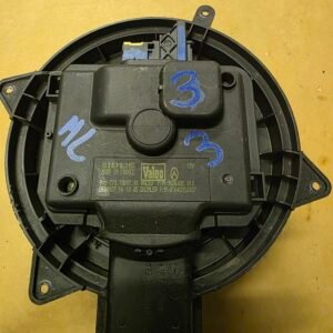 Circular black automotive clock spring module with blue handwritten '3' mark on top plate.